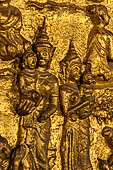 Luang Prabang, Laos - Wat Mai the gilded stucco engravings of the veranda. They narrate the Vessantara Jataka with scenes of everyday life.